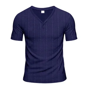 Close-up of navy blue men's Henley shirt with waffle texture and two-button collar