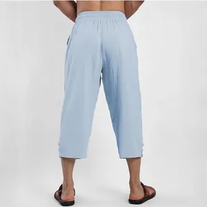 Detailed back view of men's light blue cotton linen cropped pants with elastic waistband
