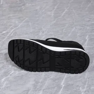 Detailed view showing the non-slip rubber sole of black wedge platform sandals for women.