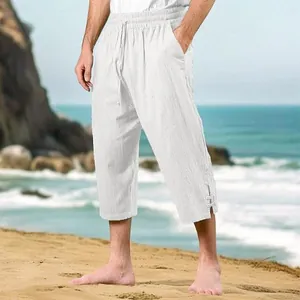 Men's breathable white cotton linen cropped trousers with drawstring waist on beach