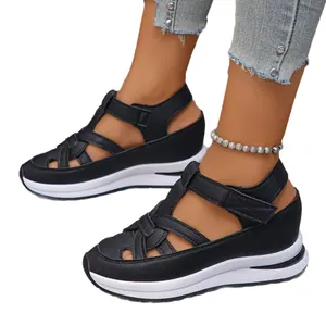 Stylish black women's wedge sandals featuring Roman style straps and thick white platform