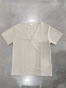 Detailed flat lay of a beige slub linen-texture short sleeve Henley T-shirt for men