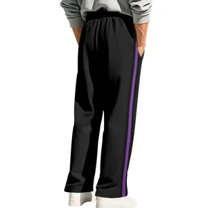 Detail back view of men's black flared sweatpants with a stylish purple side stripe