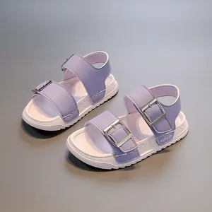 Close-up detail of stylish lavender purple children's sandals with silver buckles