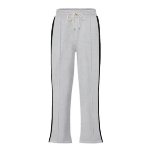 Close-up view of grey high-street joggers with black side stripes and drawstring