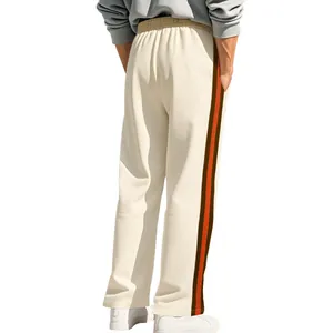 Detail showing the brown and orange side stripes on cream flared men's sweatpants
