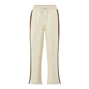 Stylish men's cream flared sweatpants featuring brown side stripes and drawstring waist.