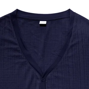 Close-up of navy blue Henley shirt neckline with textured waffle fabric details.
