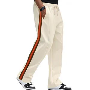 Hip hop men's cream flared sweatpants featuring brown and orange side stripe detailing
