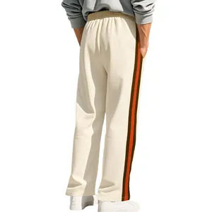 Detailed back view of men's cream flare sweatpants with brown and orange side stripes