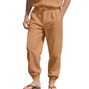 Close-up of men's casual linen jogger pants featuring drawstring waist and elastic cuffs