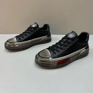 Stylish black men's leather skate shoes with metallic silver toe and detailing.