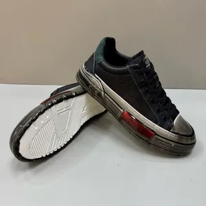 Men's trendy black sneakers with metallic silver soles and red accents