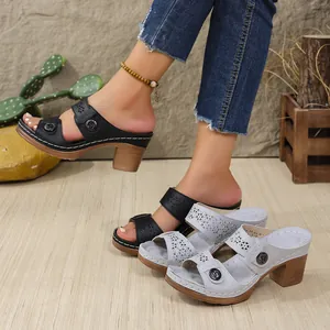 Detail of women's hollow-out PU wedge sandals featuring retro stitching and thick soles