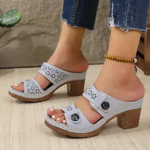 Detailed shot of retro light blue hollow-out platform sandals with stylish stitching and block heel