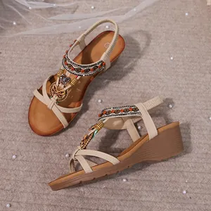 Bohemian style wedge sandals for women with colorful rhinestone beads and metal charms.