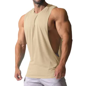 Detail of beige men's gym tank top with wide armholes and breathable cotton fabric
