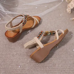 Detailed view of bohemian wedge sandals with rhinestones and colorful beads