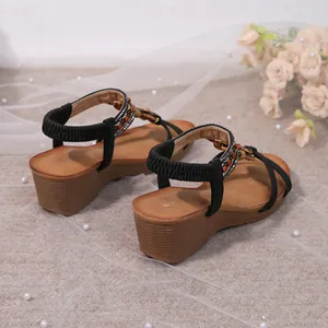 Elegant Bohemian wedge sandals with colorful beads and sparkly rhinestone detailing.