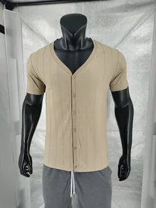 Detail shot of men's khaki Henley shirt with linen-like texture and buttoned V-neck.