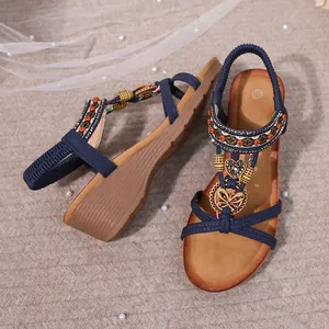 Stylish Bohemian navy blue wedge sandals featuring rhinestone butterfly and heart charms