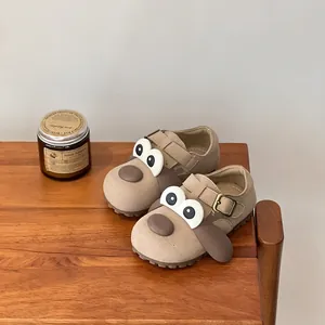 Adorable beige cartoon dog kids Birkenstock shoes featuring large ears and eyes detail
