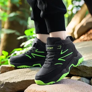 Durable boys high-top outdoor hiking shoes with neon green accents for trekking