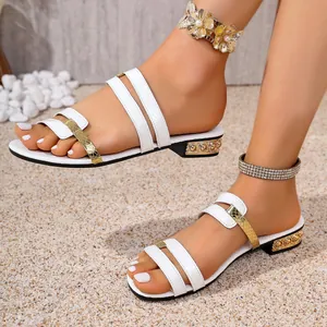 Stylish summer women's flat sandals featuring white and gold snake texture straps