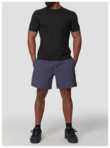 Full view of men's quick-dry black crew neck sports T-shirt with purple shorts