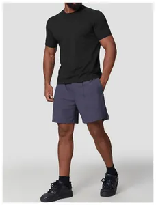 Detail view of men's breathable black sports T-shirt and blue outdoor hiking shorts