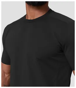 Close-up of black men's athletic T-shirt showing crew neck and quick-dry fabric detail.
