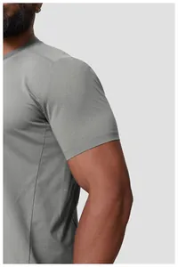Close-up of grey quick-dry sports t-shirt sleeve showing fabric texture and athletic fit.