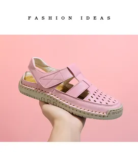 Detailed side view of breathable pink hollow-out closed-toe leather sandals for women