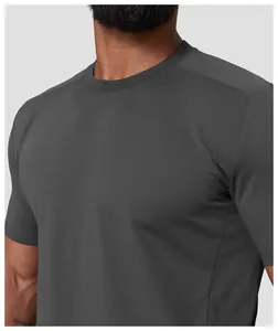 Close-up detail of grey men's moisture-wicking sports t-shirt with ribbed crew neck