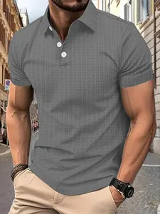 Close-up of grey knit Polo shirt with textured micro-checkered pattern on model