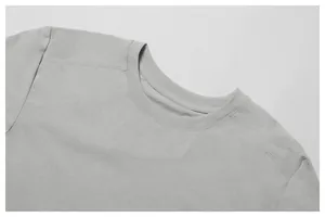 Detailed macro shot of the ribbed neckline and fine stitching on a grey quick-dry sport T-shirt