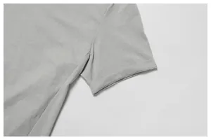 Detailed macro view of the sleeve and stitching on a grey quick-dry athletic T-shirt.