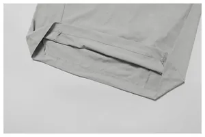 Close-up view of the double-stitched hem on a grey cooling quick-dry sports T-shirt
