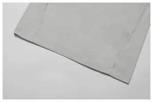Close-up detail of the durable hem stitching and quick-dry fabric on a gray T-shirt
