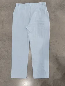 Detailed back view of men's breathable light blue vertical striped linen trousers