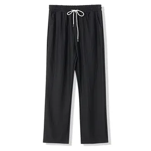 Vue détaillée du pantalon décontracté noir pour homme avec taille à cordon blanc.