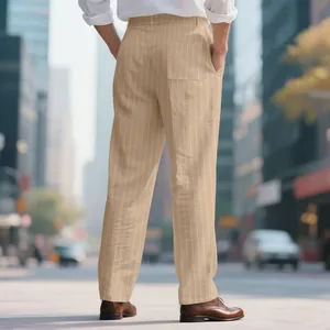 Detailed view of men's beige striped linen trousers in an urban street setting