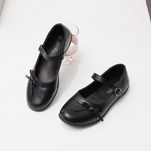 Classic black Mary Jane shoes for girls with elegant bow detail and adjustable buckle strap