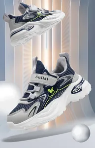 Detailed side view of boys' breathable mesh sports sneakers with Velcro straps.