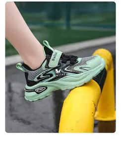 Breathable mesh boys' sports shoes with green and black athletic design