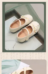 Detailed view of girl's cream leather Hanfu shoes with floral embroidery and pearls