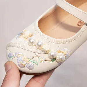 Elegant cream girl's princess shoes featuring floral embroidery and pearl details