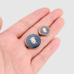 Elegant Japanese enamel gold-rimmed buttons with intricate crest design for high-end clothing