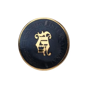 Vintage blue enamel button with gold 'A' crest and international lettering for coats