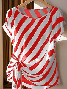 Detail of plus size women's red and white diagonal striped top with side knot